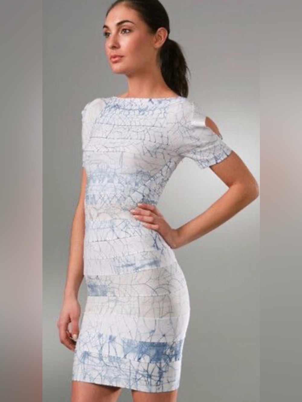 Herve Leger bandage dress featuring a white base with a blue cracked
